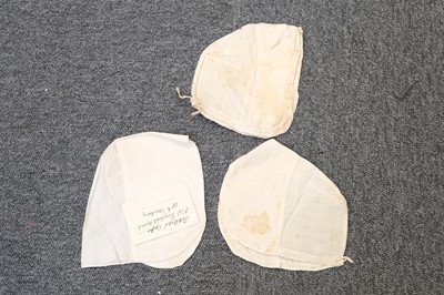 Lot 292 - Children's Clothing. A rare early infant's dress, 18th century, & 4 18th century bonnets
