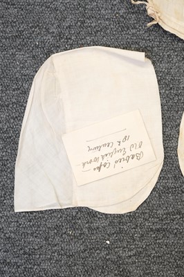 Lot 292 - Children's Clothing. A rare early infant's dress, 18th century, & 4 18th century bonnets