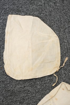 Lot 292 - Children's Clothing. A rare early infant's dress, 18th century, & 4 18th century bonnets