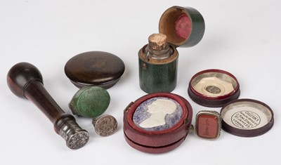 Lot 513 - Desk seals. A George III silver fob seal and other items
