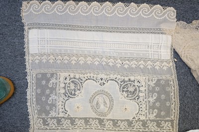 Lot 332 - Lace Veil. A needlelace wedding veil, late 19th/early 20th century, & other lace items