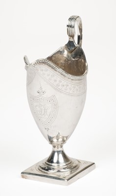 Lot 402 - Cream Jug. A George III silver helmet shape cream jug by Peter and Ann Bateman, London 1791