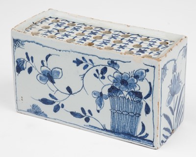 Lot 560 - Delft. An English delft blue and white flower brick, circa 1750
