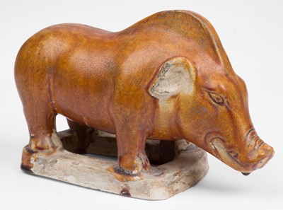 Lot 580 - Chinese Boar. A Chinese chestnut-glazed model of a boar, probably Tang dynasty (618-907)