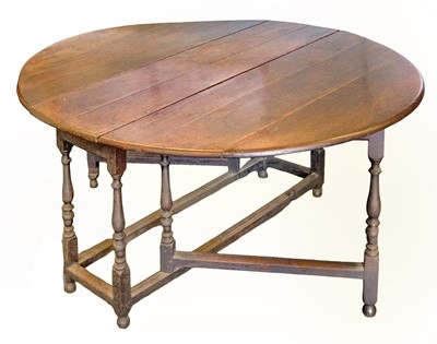 Lot 498 - Table. A George III oak gateleg table