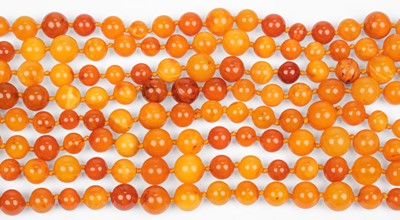 Lot 438 - Amber. A string of butterscotch amber beads