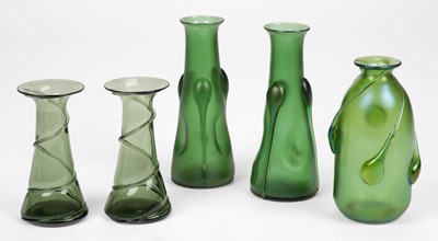 Lot 550 - Art Glass. A pair of Art Nouveau green glass vases