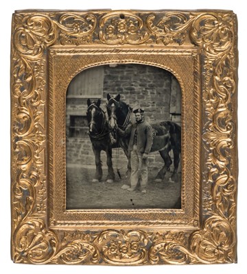 Lot 488 - Sixth-plate ambrotype of a stable-hand and two horses outdoors
