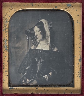 Lot 328 - Sixth-plate daguerreotype of a seated lady holding a cased daguerreotype